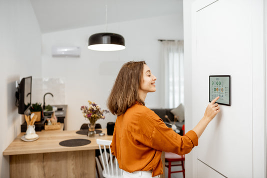 A Woman Using a Tablet as her Smart Home Controller